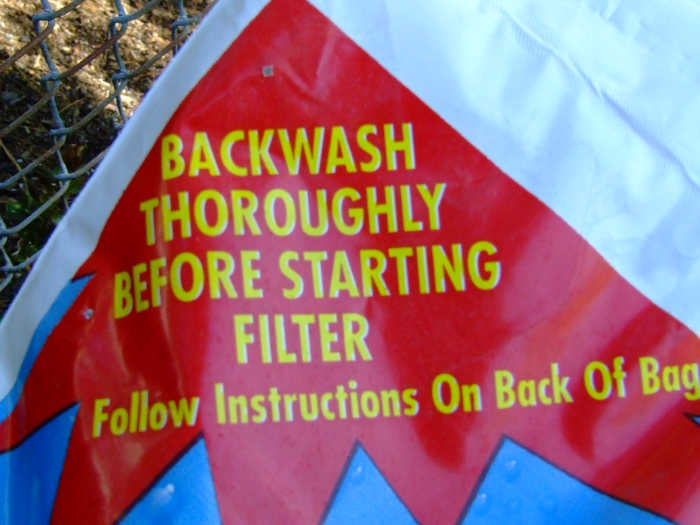 Backwash first before circulating the water back into the pool.