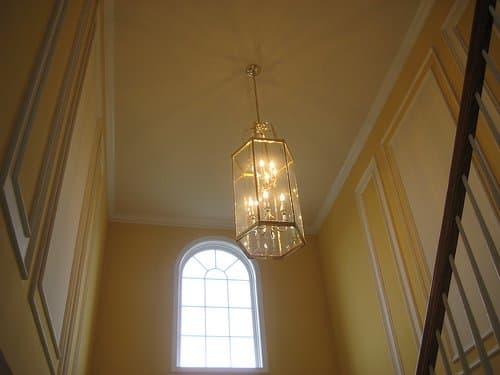 Architectural features like bannisters, molding, and stairs often play into the line element of room design.