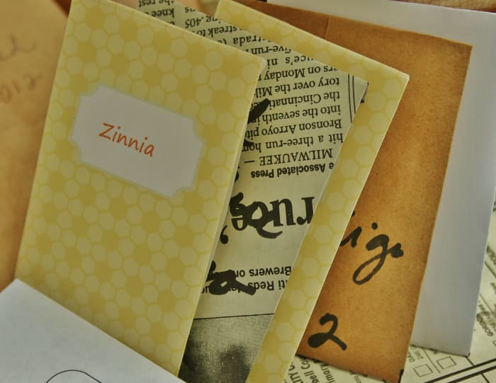 Homemade seed packets are a great way to repurpose old newspapers, paperbags & wrapping paper.