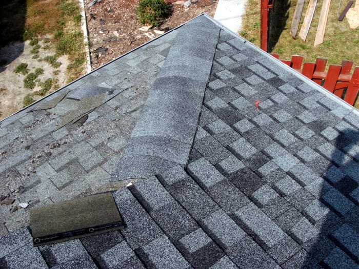 This hip is done the same way that the top ridge is, while also making sure that rainwater has no way to get under the top shingle.