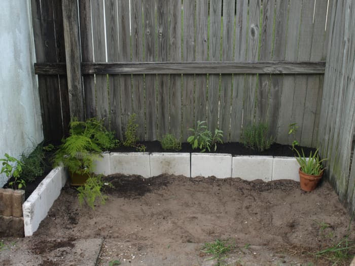 With the plants in, there are only a couple of finishing touches to complete this herb garden sanctuary.