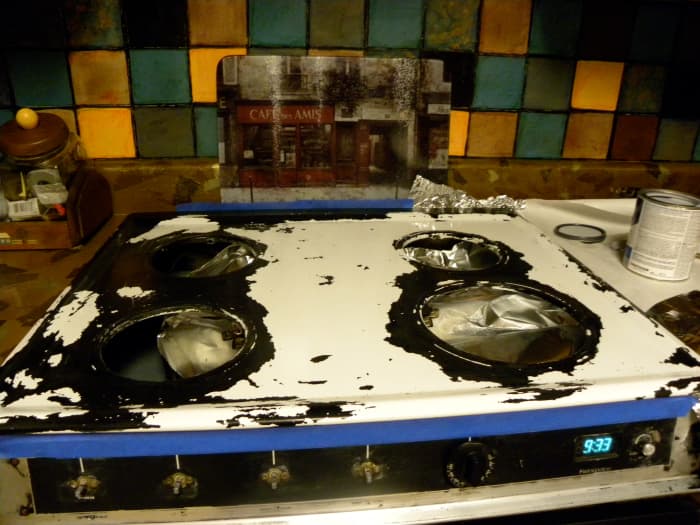 Stovetop disaster: Black paint was removed by oven cleaner spray.
