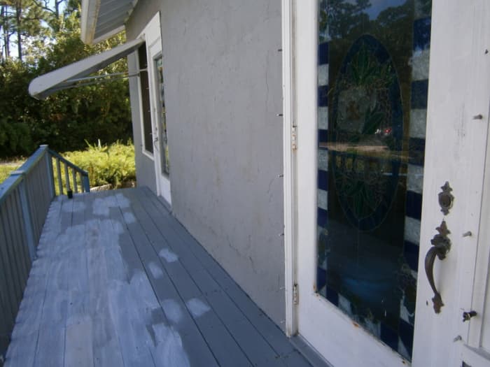 The porch is primed and ready for painting. You can see my dining room door that I faux-glass stained. Another project!