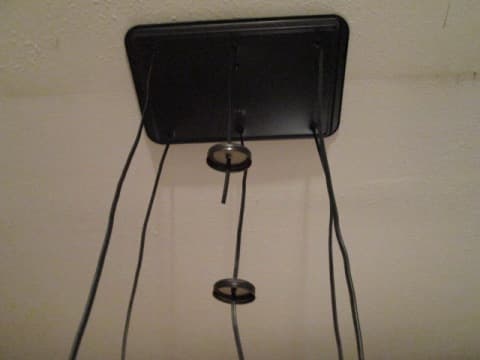 Slide your mason jar lids to the appropriate levels on the cords before attaching them to the sockets.