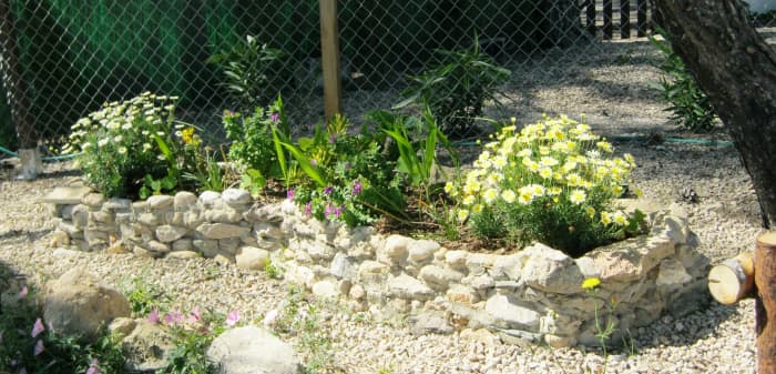 This planter filled an awkward spot between a fence and the top of a steep banking and took a few hours to build and fill.