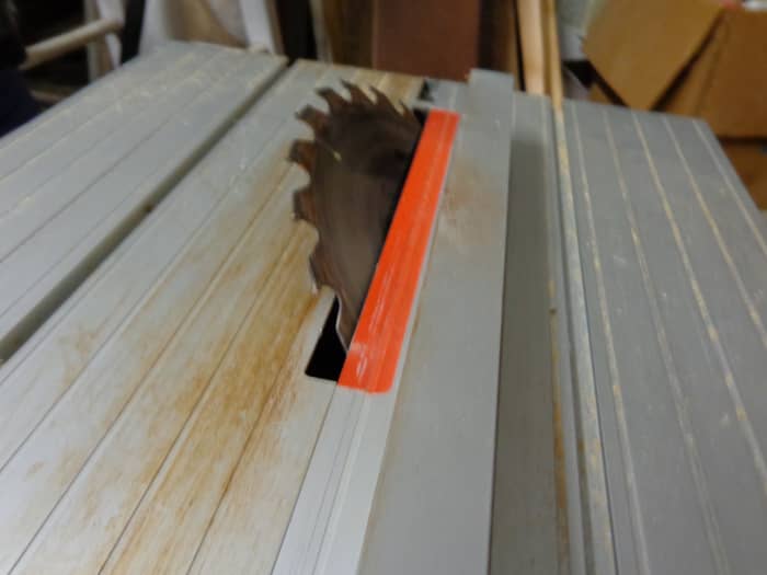 Table saw set to 45-degree angle. The edges of each handle were trimmed for several inches back to begin shaping the grips.