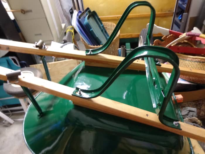 Legs and wedges assembled to handles and to bucket, as well as front braces. Note that front braces and legs are under stress in their correct positions. Use the old handles to accurately pre-drill bolt holes, then align metal parts accordingly.
