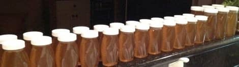 Beautiful Honey Bottled. This honey was from my first harvest three and a half months after receiving my bees. Not bad!
