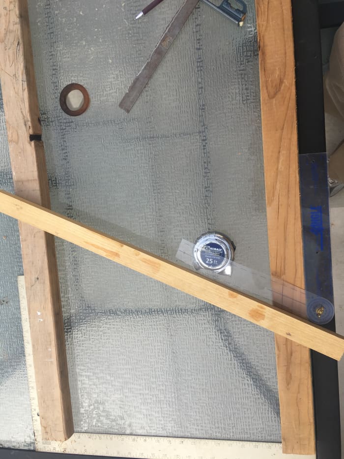 For the purpose of illustration, in this photo the handrail board was moved a lot closer to the carpenter's square representing the floor.