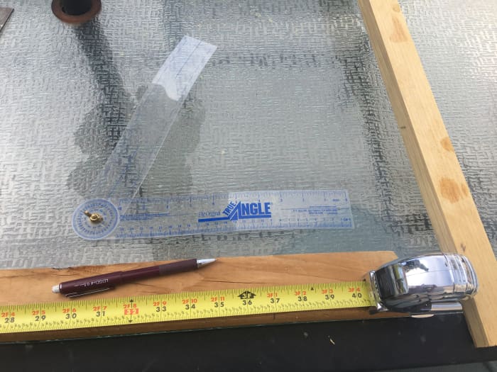 After squaring up and spacing the post boards, use a tape measure to make a small pencil mark on edge of a post at your desired height.