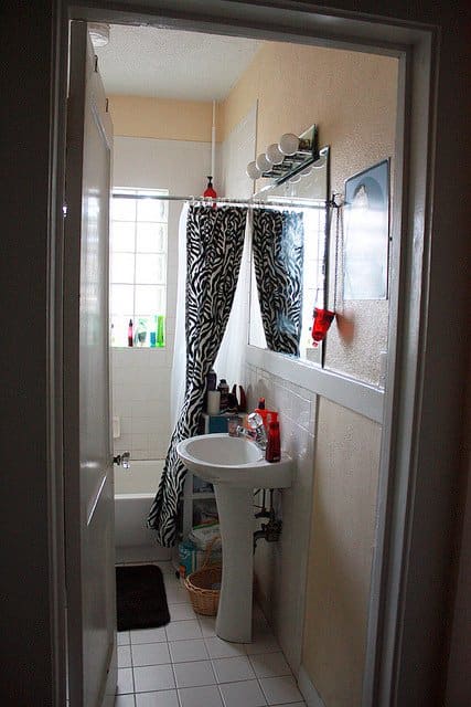 Small bathrooms create many challenges, but the most important one is not cluttering the space. Keep it clean, and introduce natural lights and good ventilation.
