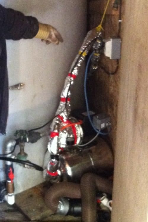 The pump connects to the cistern in a galvanized 1" suction line, complete with isolation valve and union.