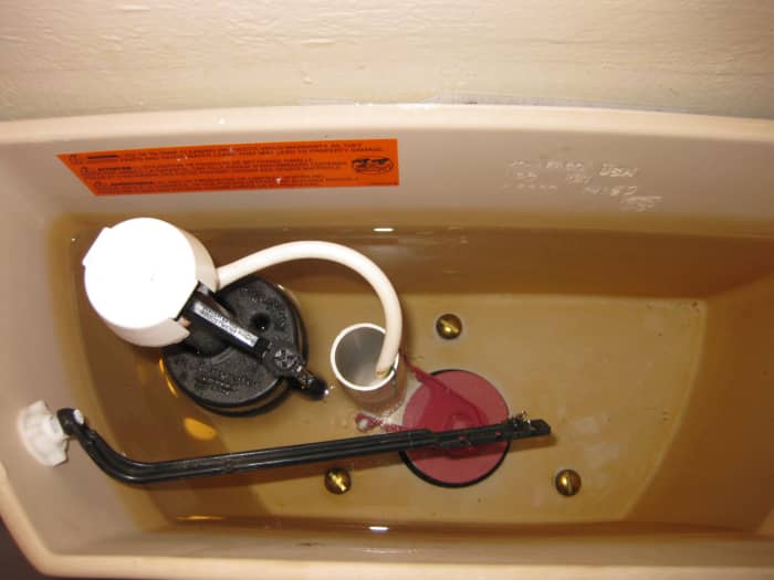 Note the three screws in this Kohler toilet. It requires a triangular tank to bowl gasket that is specific to this brand of toilets.