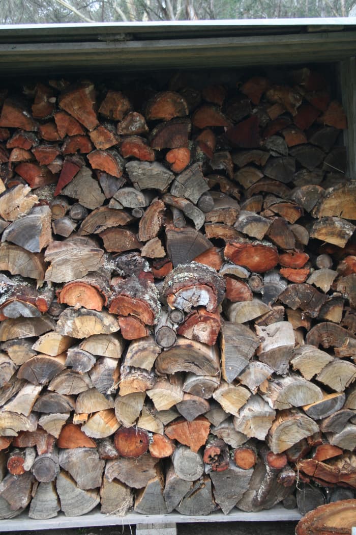 A lot more effort goes into chopping wood than making newspaper logs for a fire. If you're not handy with an axe or don't have access to free wood, use the paper brick option.
