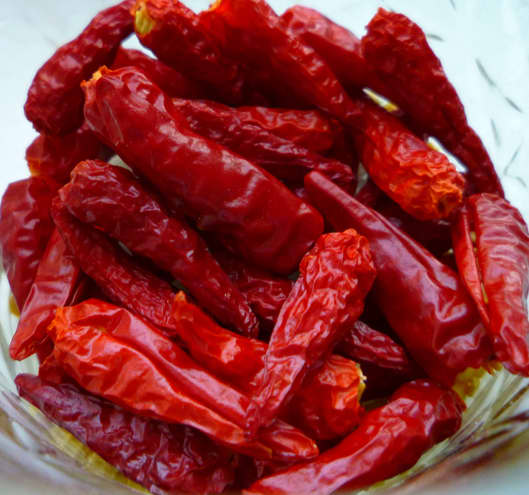 Dried pequin peppers. Containing a bit of heat, these dried peppers have a superb smoky flavor that pairs well with many cuisines!