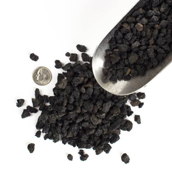 Lava rocks, another great coarse aggregate used in creating your perfect bonsai mix. Notice the dime used to reference the small size.