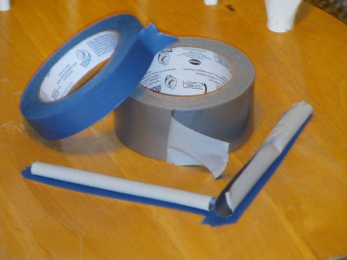 This is curled duct tape over masking tape. Put it around your bed, so that when the bugs come visiting, they get caught.
