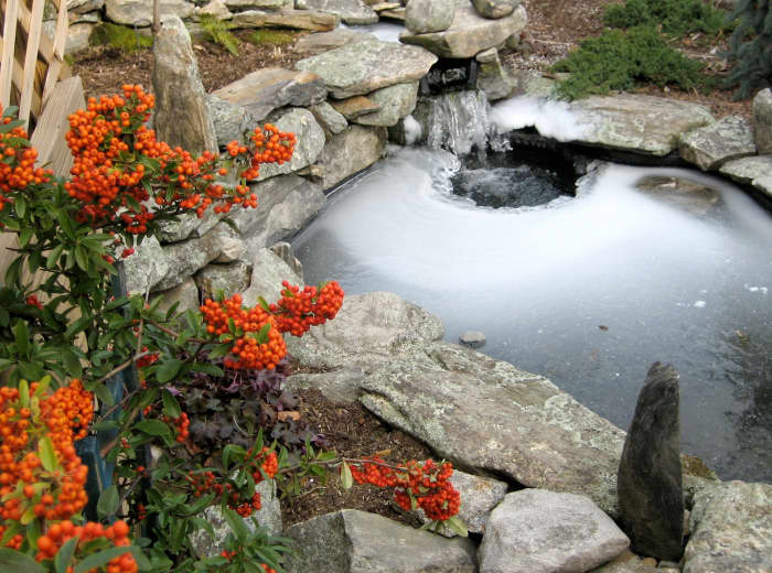 A pond edged with stones.