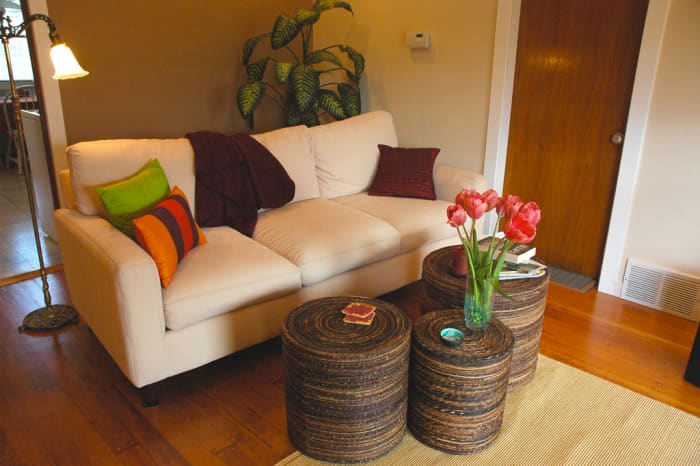 The small round tables work beautifully in front of the couch but can be moved to provide table space or even seating elsewhere in the room.