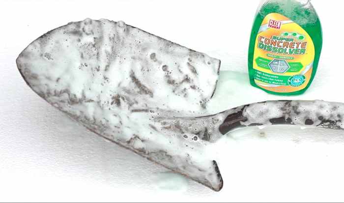 DURING: Shovel with a concrete dissolver activating.