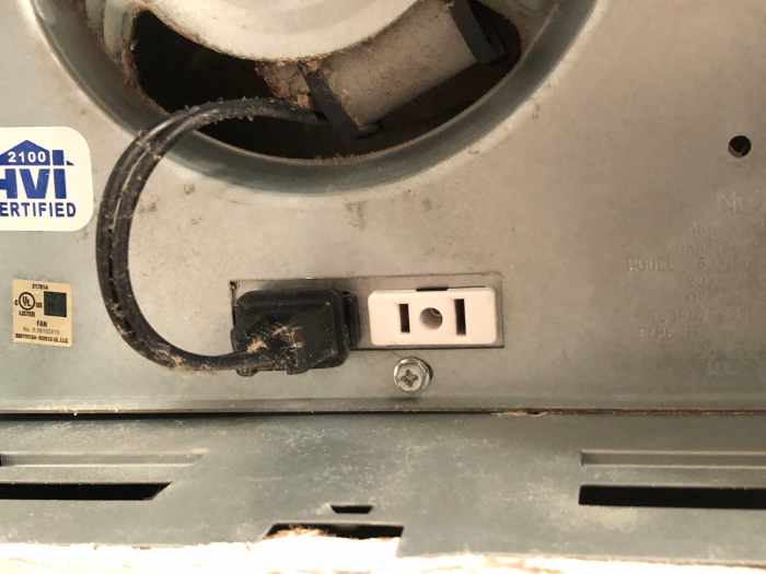 This unit's fan motor plugs into one electrical receptacle and its light plugs into the other.
