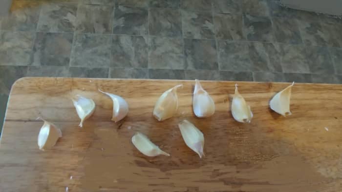 Separate each clove of garlic, leaving a layer of skin on them. The largest cloves will grow the biggest bulbs.