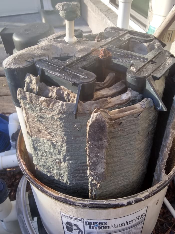 These grids have severe DE build-up. This was causing the "blow-back" to the pool/spa returns.