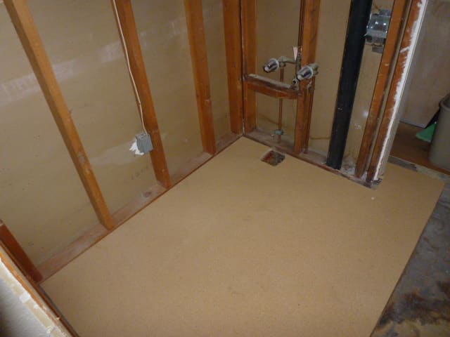 New subfloor is installed. The opening for the drain will have to be made larger eventually, but that was easy enough with a sawzall.