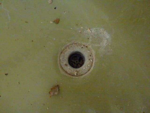 The old drain refused to come out. The small cross pieces in the drain that are used to unscrew the drain simple broke free from the drain instead of turning it.