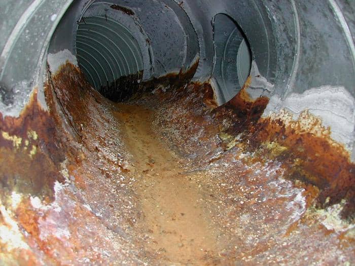 Whether metal or plastic, it's not uncommon for older underground ducting to take on water. New codes have helped minimize this risk but with settling and age, it's hard to guarantee.