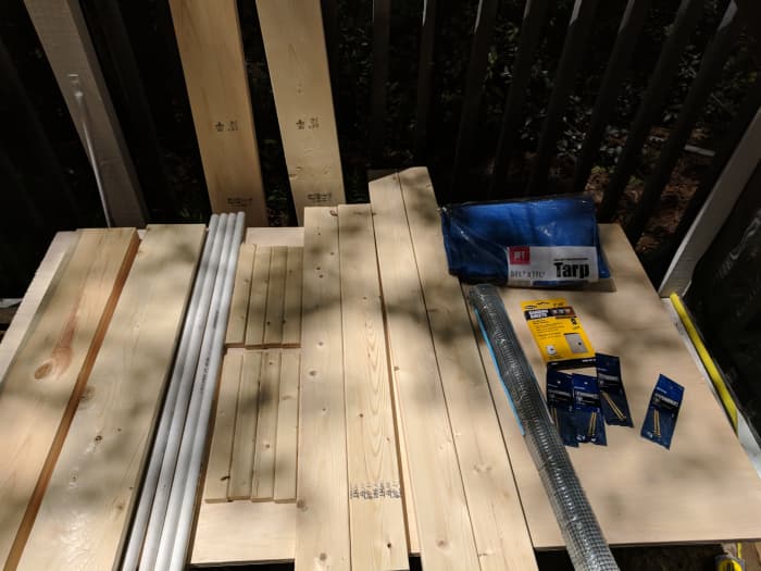 Here's all of my supplies, laid out. Since I don't have a workspace, I put my plywood sheet on the saw horses and used that as a table until I was ready to use the plywood.