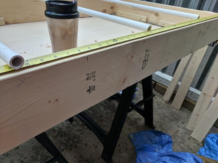 Measuring where I need each support to go. I ended up using 3 supports since my dog is 20 lbs, but you may want to use all 4 supports if your dog is 20 lbs- 35 lbs. if your dog is over 35 lbs, you may want to consider a different materials.