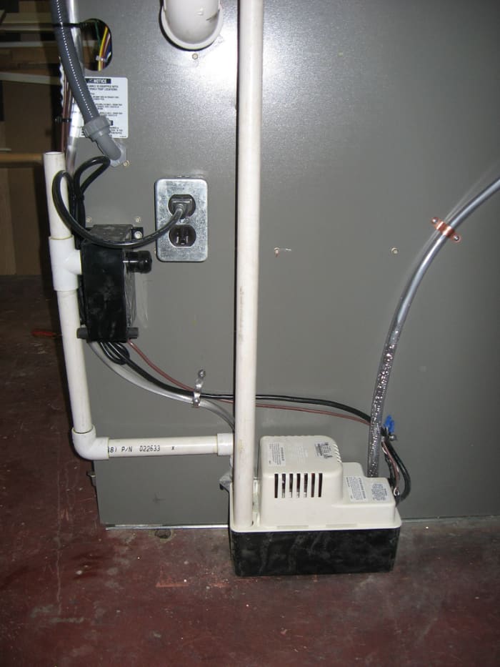 A view of the condensate pump on an air conditioning unit.