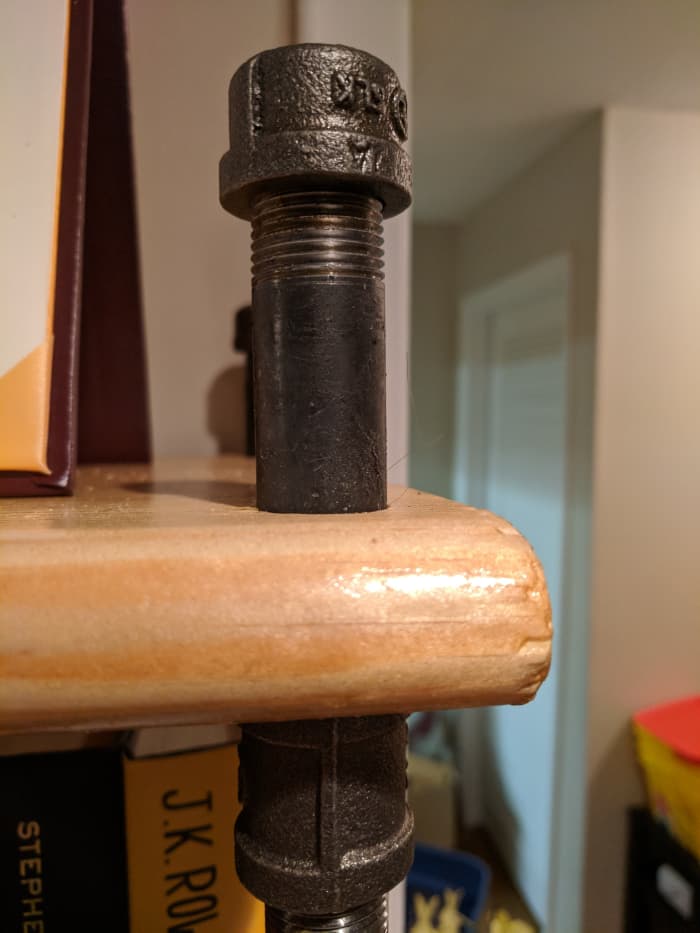 Here's what the last step will look like: 3 inch pipe slid through and screwed in to coupling, then capped on the other end.