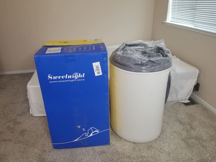 Unpacking the rolled up mattress wasn't too difficult, but it doesn't hurt to have a second person to help position the 64 pound mattress.