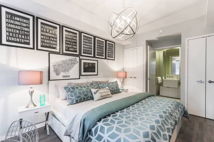 Metallic lighting fixtures give the room a sparkle that contrasts against the textural hard surface flooring.