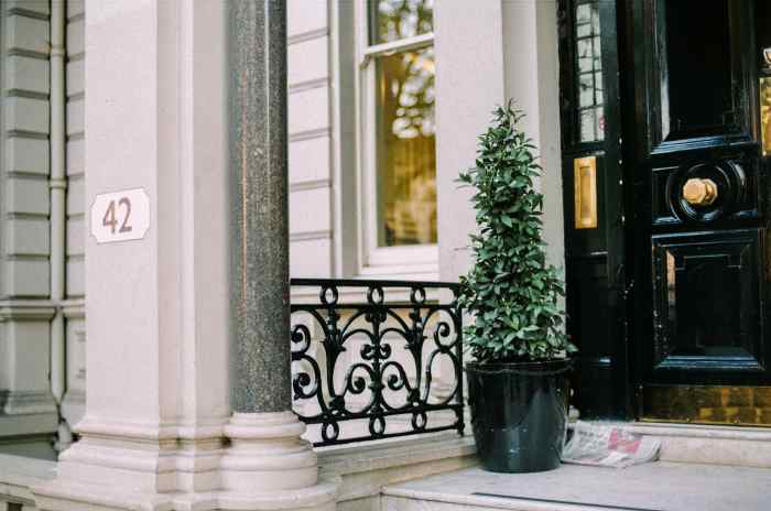 A new brass kickplate, door knob and mail slot creates a fancy welcome.