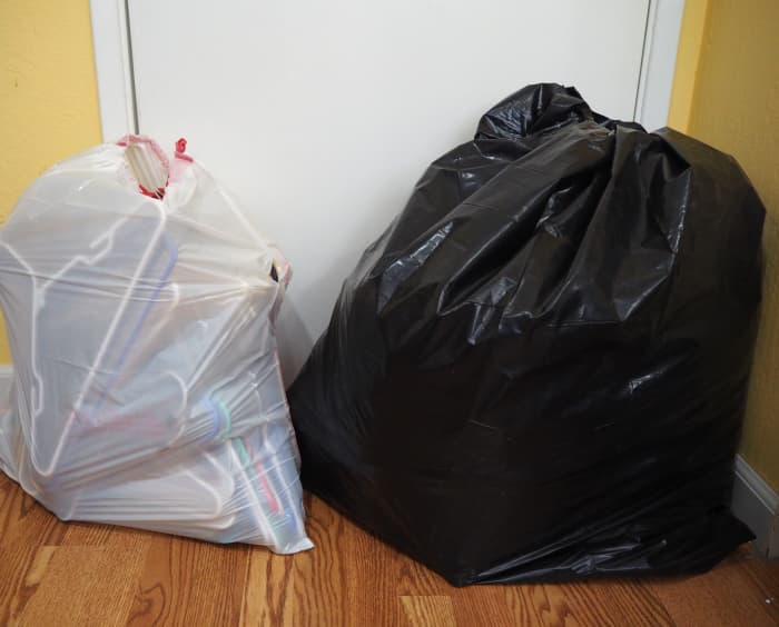 Second such large contractor trash bag of clothing, plus a second bag: look at all those extra hangers!