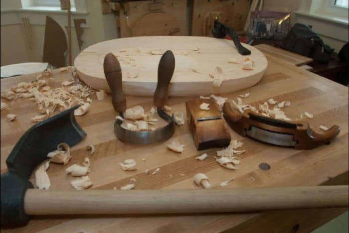 From left to right, adze, scorp, compass plane & travisher used to carve seat. Photo by R. Galbraith.