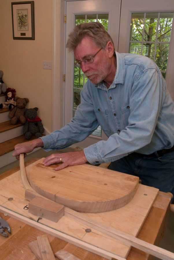 Steam bending the chair bow.