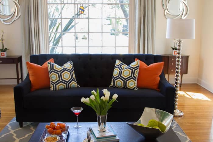 Buy an inexpensive pillow or bring one in from another room and it will add a fun pop of color to the room.