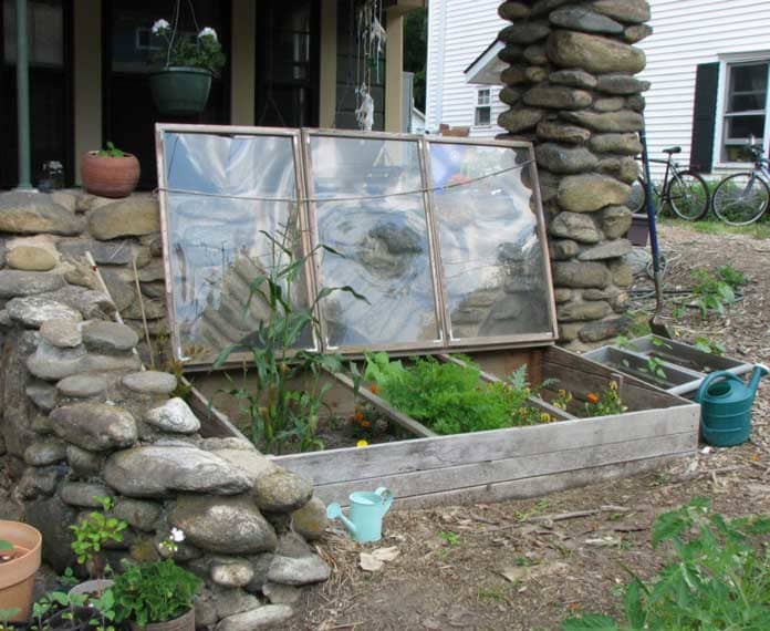 A homemade cold frame is just as effective as one you pay a lot of money for. A bottomless wooden box covered with an old window will work great.