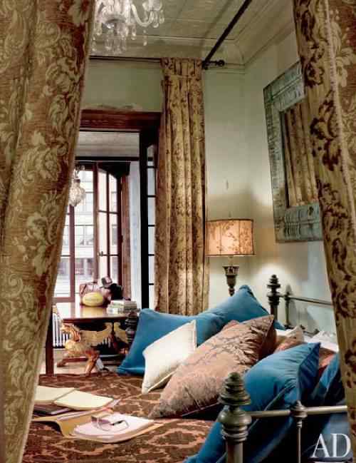 Ornate fabric and curtains add a touch of elegance to the bedroom.