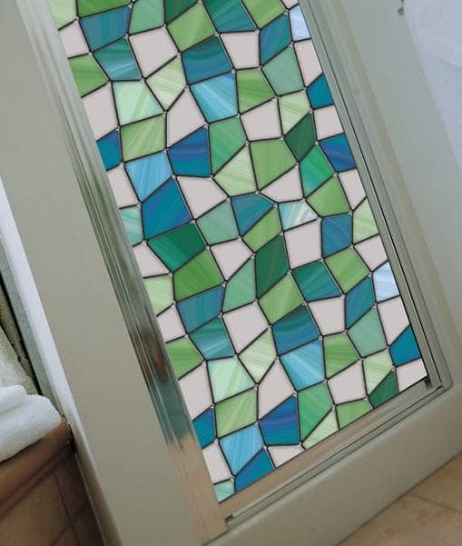 Stained glass paint kits or decorative window film is a great way to spiff up your kitchen cabinets.
