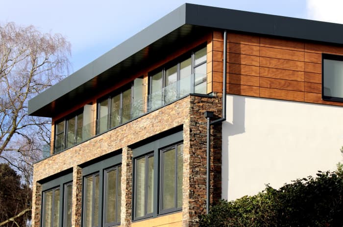 Exterior walls are almost always load bearing and typically include multiple beams and headers that give further evidence of their load-bearing capability.