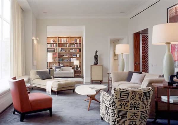 A large and open living room space with three different seating zones. 