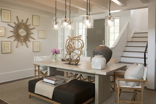 Key decor items in this room are framed art, wall clock, pendant lights, and the tabletop decorations. A great way to accessorize an interior space. Notice how they make the room look elegant and professionally put-together.