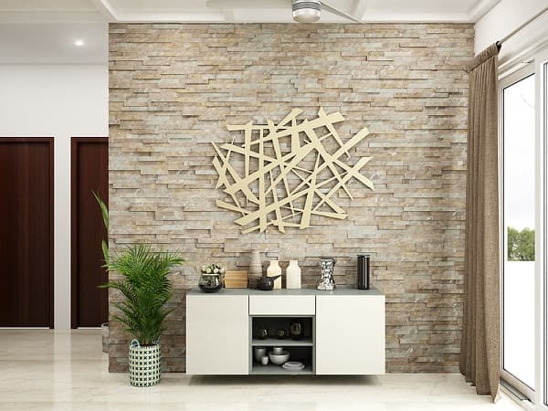 A unique feature wall with faux stone application and an elaborate metal wall art.