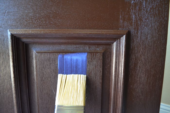 Use a quality painter's brush to apply the topcoat, rather than the foam brush and rags used for applying the gel stain. The top coat looks milky in the can and as it is applied, or strangely blue as in this photo. However, it dries clear.