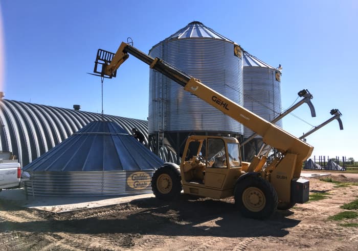 For bin going onto hopper: The single concrete segment on which this bin and hopper is being erected must hold over 100 tons when the bin and hopper are filled with wheat.